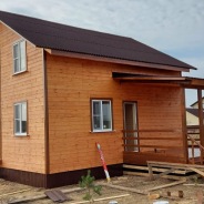 Фото готовых работ - Каркасно-щитовой дом 7,5х7,5 м + терраса 3х4 м.